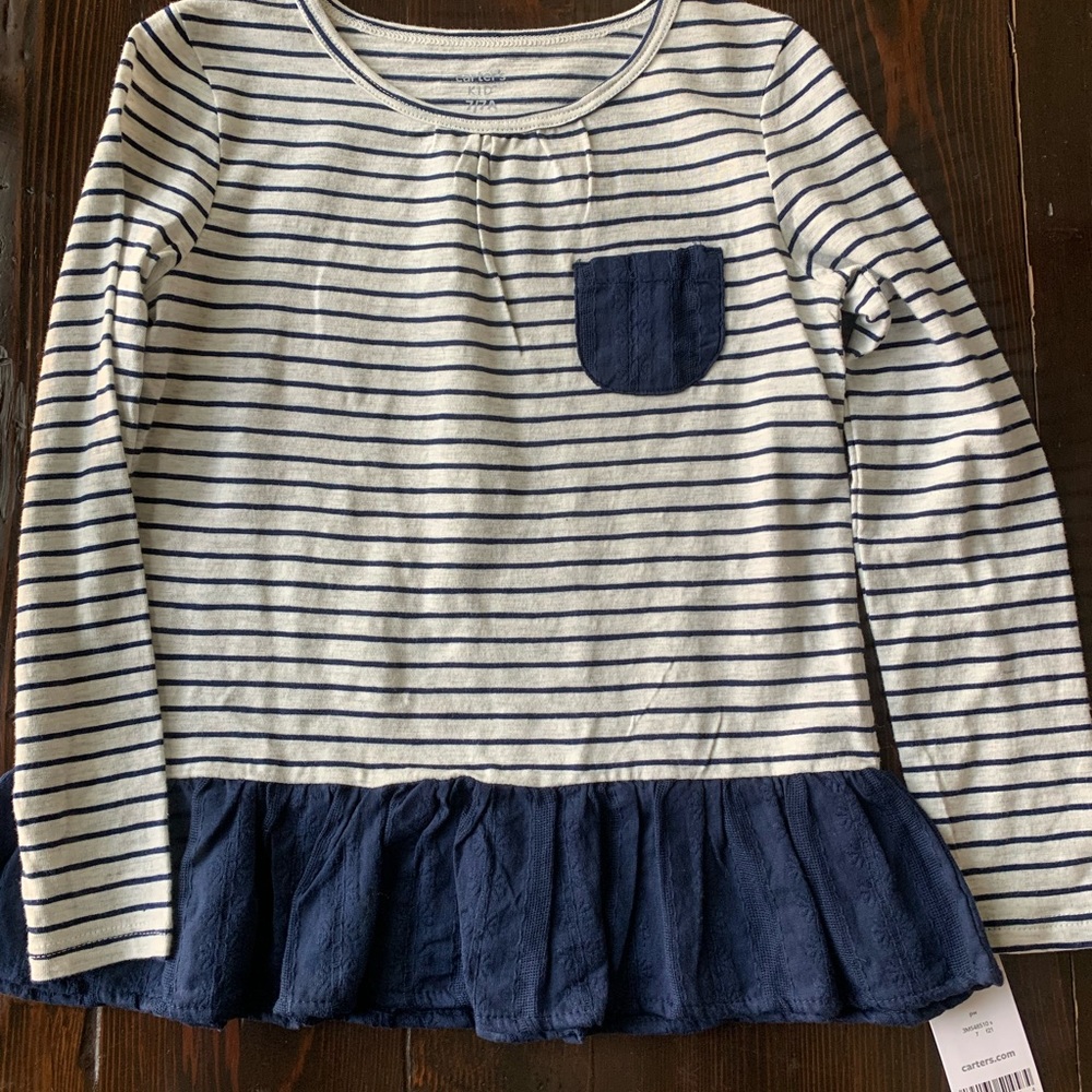 Carters long sleeve top. Brand new, never worn. Size 7.